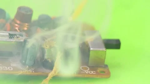 Damaged electrolytic capacitor on the printed circuit board. Stock Footage 165416353