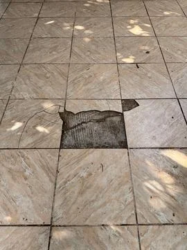 Damaged external ceramic flooring Stock Photos