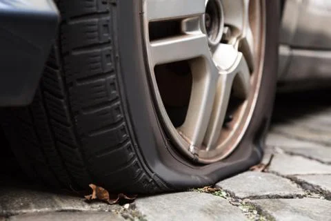 Damaged Flat Tire Of A Car Stock Photos