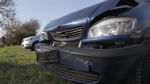 Damaged front of a dark blue Opel car after a collision Stock Footage 344811015