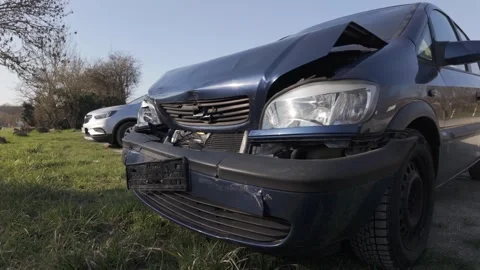 Damaged front of a dark blue Opel car after a collision Stock Footage 344811062