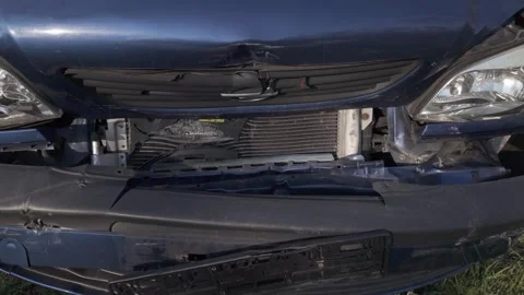 Damaged front of a dark blue Opel car after a collision Stock Footage 344811105