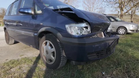 Damaged front of a dark blue Opel car after a collision Stock Footage 344811120