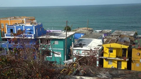 Damaged homes along the waterfront after hurricane Maria in Puerto Rico Stock Footage