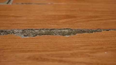 Damaged  Laminate Flooring Surface At Home. Scratched floor covering Stock Footage 152114007