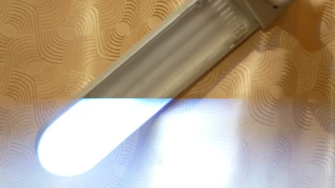 Damaged light bulb in a desk lamp. Strobe mode Stock Footage 118390980