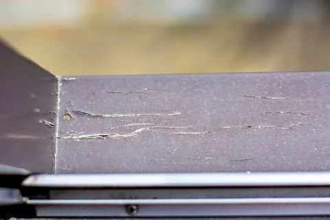 Damaged modern window frames in bad condition that need to be refurbished and Stock Photos