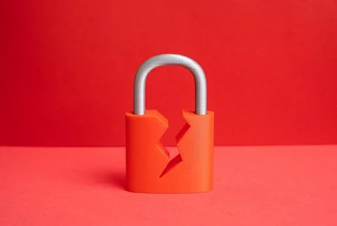 A damaged padlock. Concept of a security vulnerability. Cybersecurity. Stock Photos