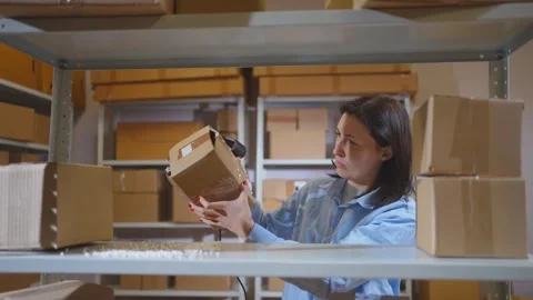 A damaged parcel in the warehouse is not satisfied with the employee Stock Footage 272424921
