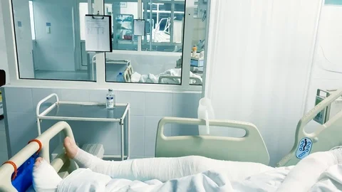Damaged patient in hospital reanimation intensive care unit room Stock Footage