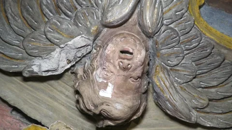 Damaged Polychrome Angel Sculpture During Church Restoration Video stock 345213938
