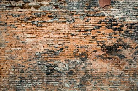Damaged red brick wall texture Stock Photos