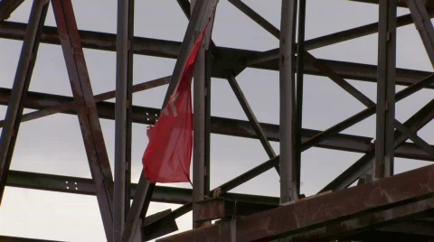 Damaged red flag moving from wind klm 5 Stock Footage 505365