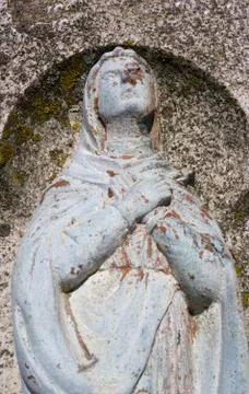 Damaged religious statue of Virgin Mary Stock Photos