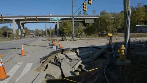 A damaged road left in the aftermath of Hurricane Helene Stock Footage 287996214