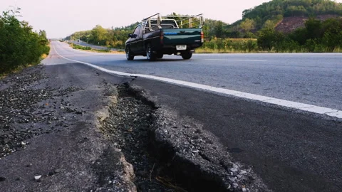 Damaged road shoulder is cracked Stock Footage 276676650