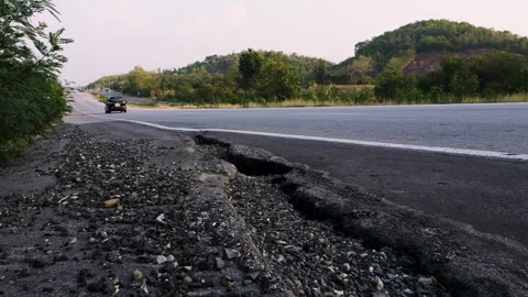 Damaged road shoulder is cracked Stock Footage 276677207