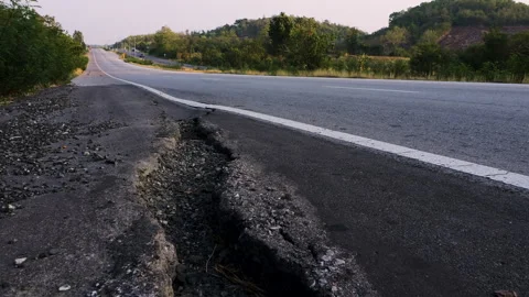 Damaged road shoulder is cracked Stock Footage 276677326