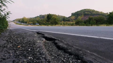 Damaged road shoulder is cracked Stock Footage 276677348