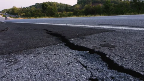 Damaged road shoulder is cracked Stock Footage 276681636