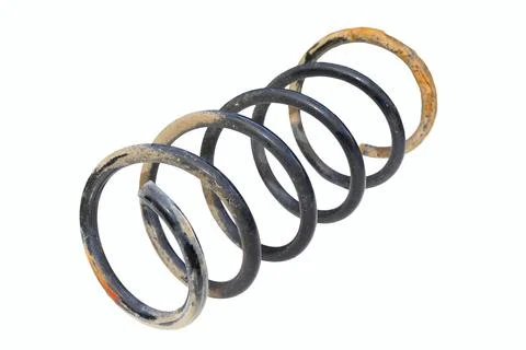 Damaged rusty old car spring on white background Stock Photos