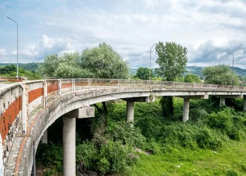 Damaged rusty road bridge in Eastern Europe Fotos Stock