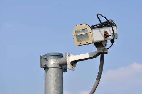 Damaged security camera case mounted with pole. Stock Photos