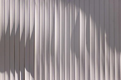 Damaged segments of plastic lining shades of whiteand gray. Stock Photos