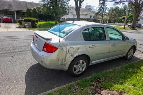 Damaged small gray car Stock Photos