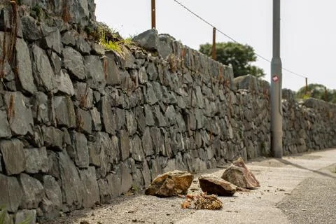 A damaged stone wall Stock Photos