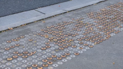 Damaged tactile ground surface indicators (TGSIs) on a public footpath Vídeo Stock 312377449