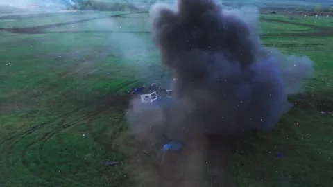 Damaged tank exploding with fire and smoke in a field Stock Footage 313255473