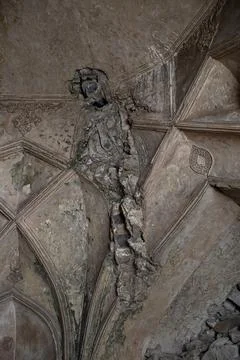Damaged vaulted ceiling with cracked plaster and exposed masonry in histori.. Stock Photos