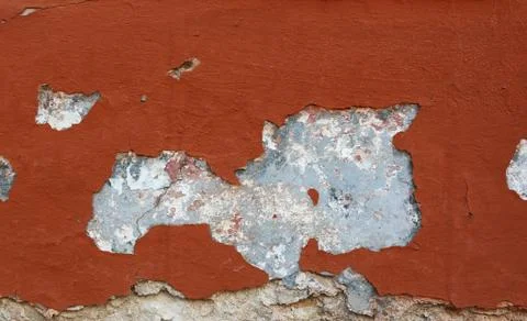 Damaged wall with red painted render background Stock Photos