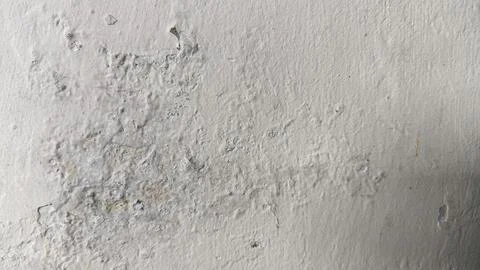 Damaged wall surface with horizontal texture showing cracks and aging signs.. Stock-Fotos