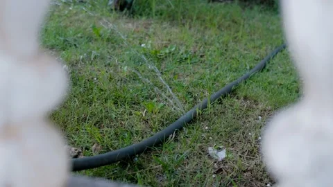 Damaged watering hose Stock Footage 158537477