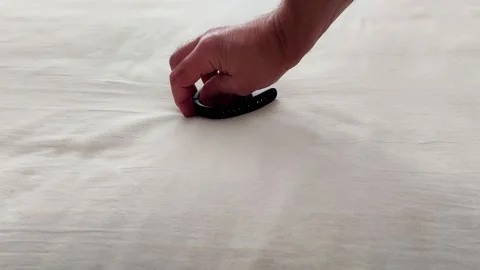 Damaged Wearable Device Strap Displayed on Soft Fabric Surface Vídeos de archivo 322895863