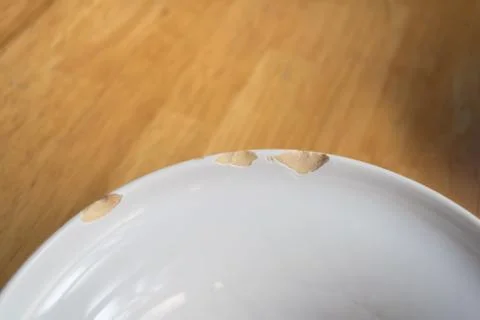 Damaged white ceramic plate Stock Photos