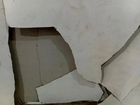 Damaged White Interior Wall With Peeling Plaster Stock Photos