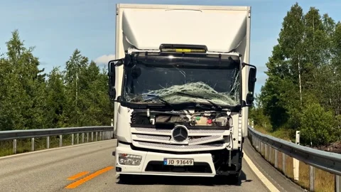 Damaged white truck with a smashed windshield pulled on the highway after a Stock Footage 341540455