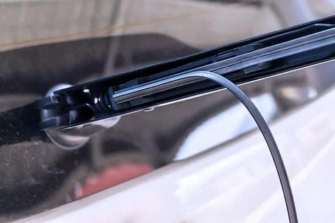 Damaged windshield wiper. Deteriorated windshield wiper blade rubber. Damag.. Stock Photos