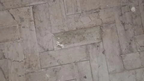 Damaged wooden parquet floor with missing tile Stock Footage 346250982