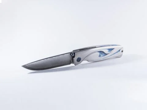 Damast custom knife, isolated on white background. Stock Photos