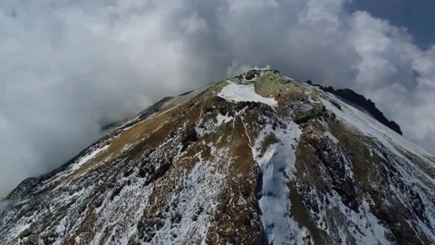 Damavand mountain as the camera gracefully pans around its, stock footage. Stock Footage 304784120