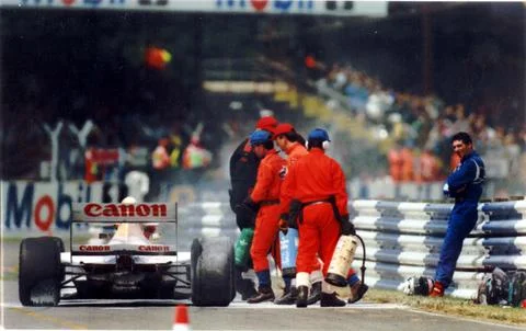 Damon Hill - Racing Driver Down And Out: Damon Hill Rests Disconsolately On A Cr Stock Photos