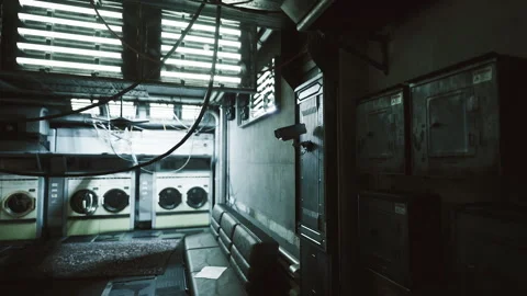 Damp industrial corridor. Dark utility space with hanging cables and cameras Stock Footage 341821794