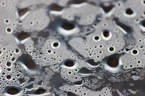 Damp macro from under the plastic material. Stock Photos