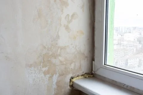 Damp wall and poor installation of plastic windows Stock Photos