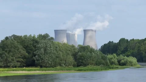 The Dampierre en Burly nuclear power plant in France, with cooling towers Stock Footage 346674979