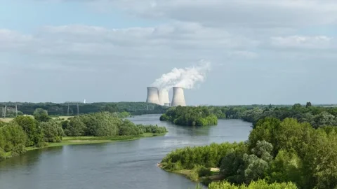 The Dampierre-en-Burly nuclear power plant in France, with its cooling towers Stock Footage 346675536
